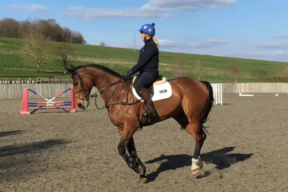 Girl cantering horse