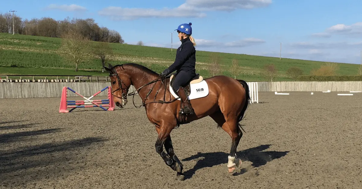 Girl cantering horse